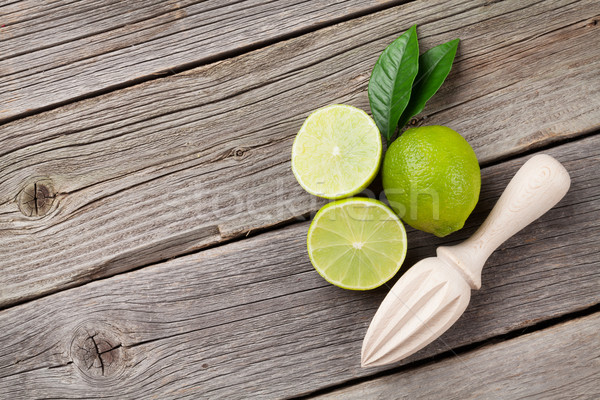 Fresh ripe limes and juicer Stock photo © karandaev