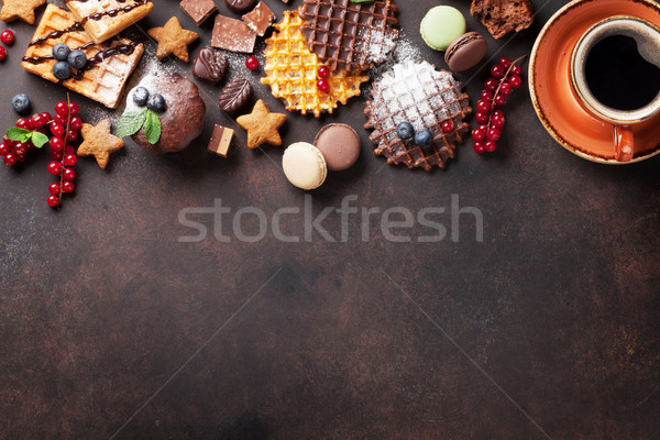 Coffee, sweets and waffles with berries Stock photo © karandaev