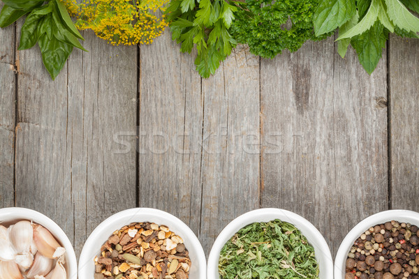 Színes gyógynövények fűszer aromás hozzávalók fa asztal Stock fotó © karandaev
