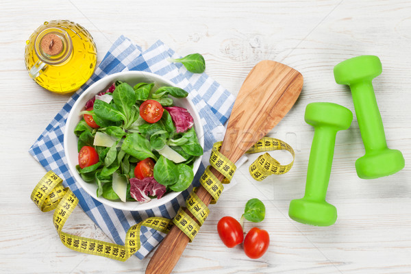 Healthy salad and fitness equipment Stock photo © karandaev