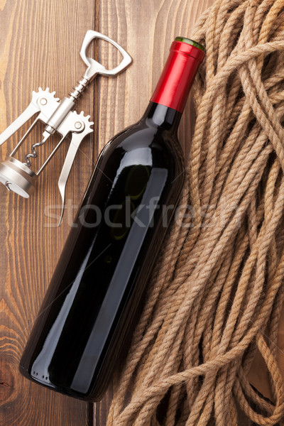 Vin rouge bouteille tire-bouchon rustique table en bois alimentaire Photo stock © karandaev