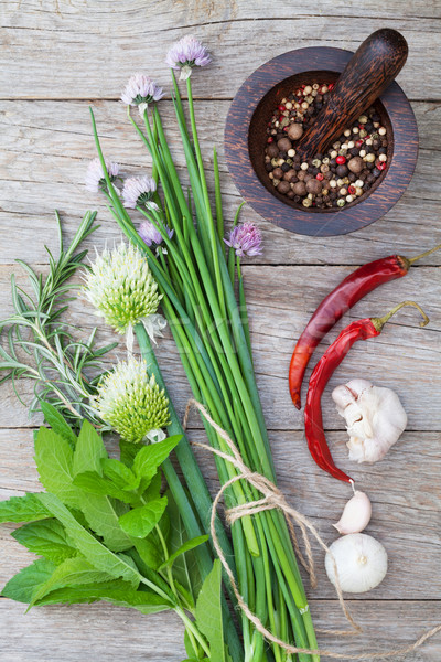 Stock photo: Fresh herbs and spices on garden table