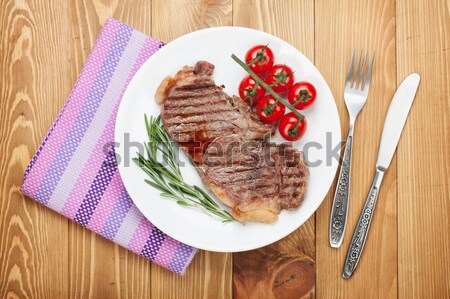 Stock photo: Grilled beef steak with rosemary, salt and pepper