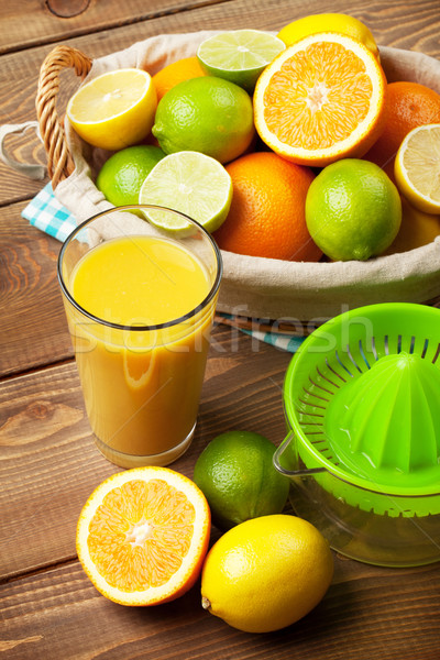 Citrus fruits and glass of juice Stock photo © karandaev