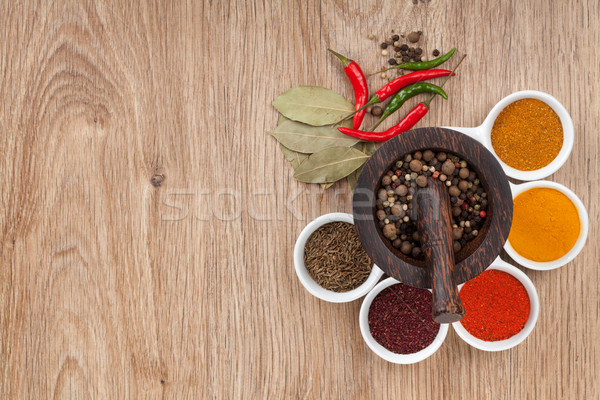 Mortar and pestle with pepper and spices Stock photo © karandaev