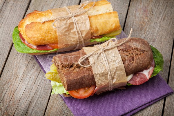 Two sandwiches with salad, ham, cheese and tomatoes Stock photo © karandaev