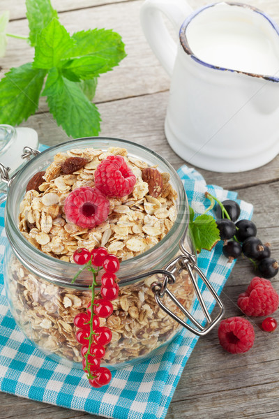 Healty breakfast with muesli, berries and milk Stock photo © karandaev