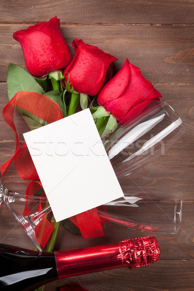 Valentines day greeting card, champagne and red roses Stock photo © karandaev