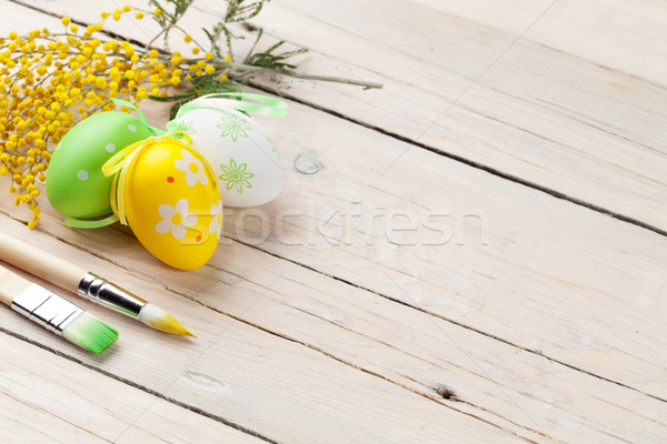 Foto stock: Colorido · huevos · de · Pascua · pintura · mesa · de · madera · vista · espacio · de · la · copia