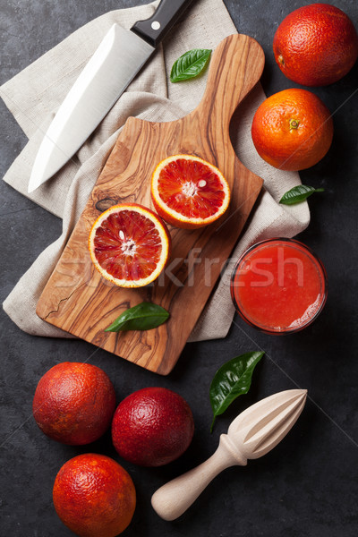 Fresh citruses and red orange juice Stock photo © karandaev