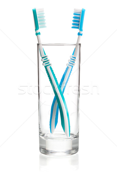 Two tooth brushes in glass Stock photo © karandaev