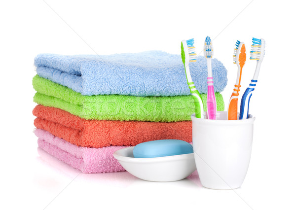 Four colorful toothbrushes, soap and towels Stock photo © karandaev