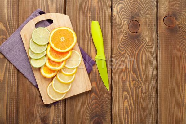 Sliced citruses on cutting board Stock photo © karandaev