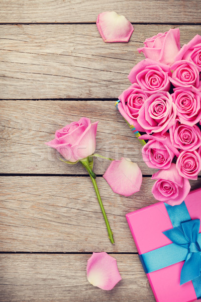 Valentines day background with gift box full of pink roses Stock photo © karandaev