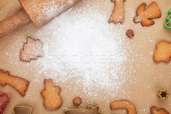 Rolling pin and gingerbread cookies on cooking paper Stock photo © karandaev