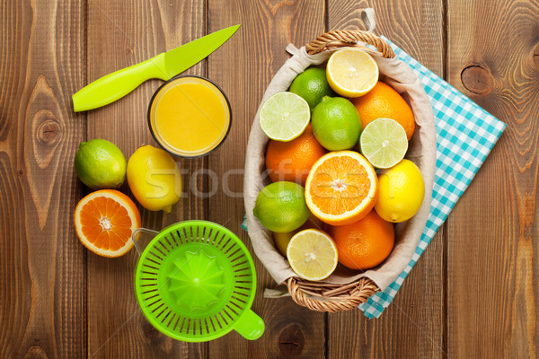 Citrus fruits and glass of juice. Oranges, limes and lemons Stock photo © karandaev