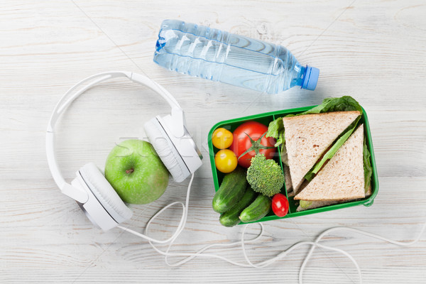 Lunch box and headphones Stock photo © karandaev