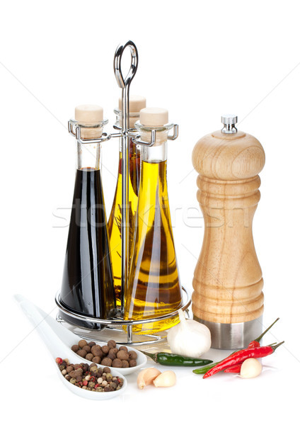 Olive oil, vinegar bottles, pepper shaker and spices Stock photo © karandaev