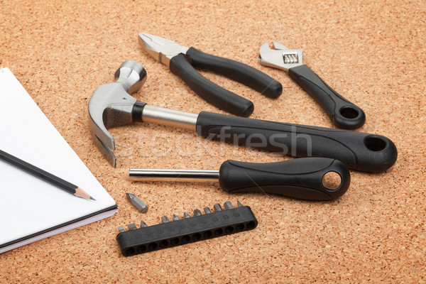 Stock photo: Set of tools on cork background