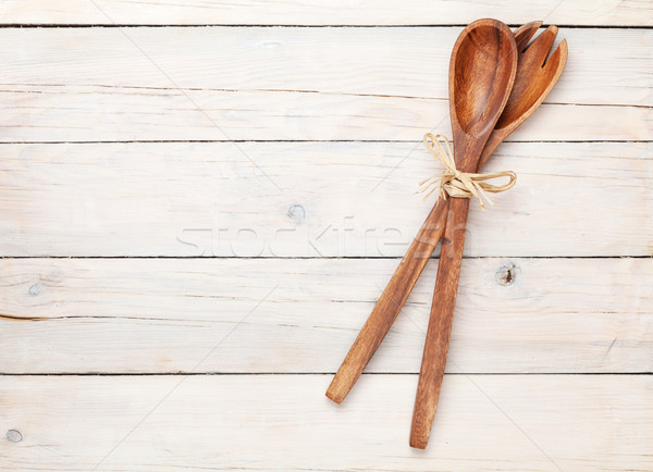 Kitchen utensils over white wooden table background Stock photo © karandaev