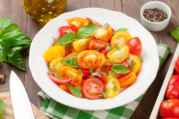 Fresh colorful tomatoes and basil salad Stock photo © karandaev