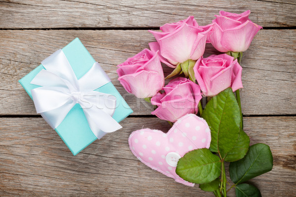 Gift box, pink roses bouquet and heart toy Stock photo © karandaev