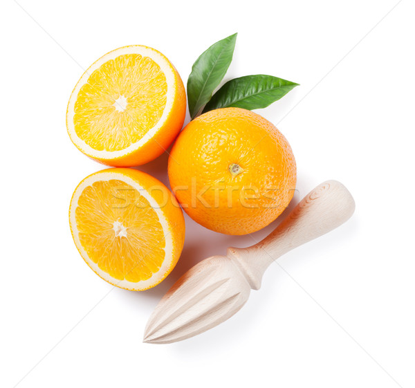 Fresh ripe oranges and juicer Stock photo © karandaev