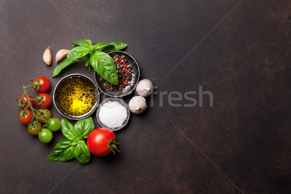 Paradicsomok bazsalikom olívaolaj fűszer kő asztal Stock fotó © karandaev