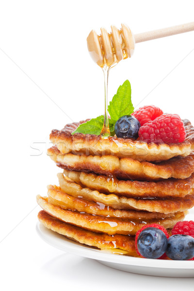 Stock photo: Pancakes with raspberry, blueberry, mint and honey syrup