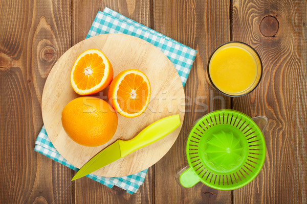 Oranges and glass of juice Stock photo © karandaev