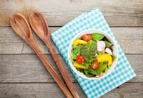 Fresh healthy salad and kitchen utensils Stock photo © karandaev