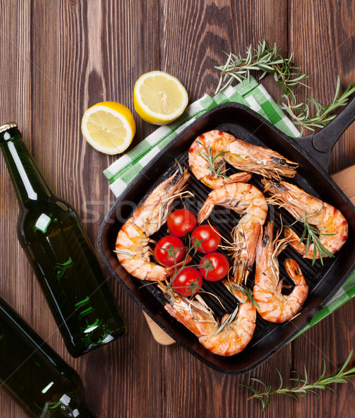 Stock photo: Grilled shrimps on frying pan and beer
