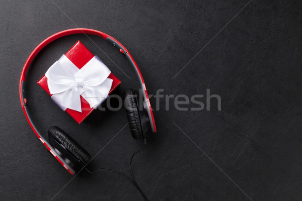 Gift box with headphones Stock photo © karandaev