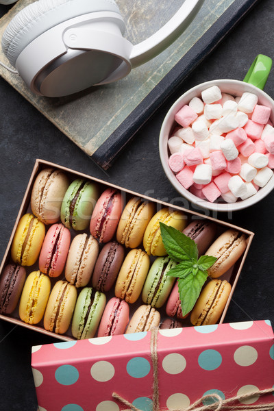 Stock photo: Colorful macaroons in a gift box and headphones