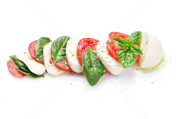 Caprese saláta mozzarella sajt paradicsomok bazsalikom gyógynövény Stock fotó © karandaev
