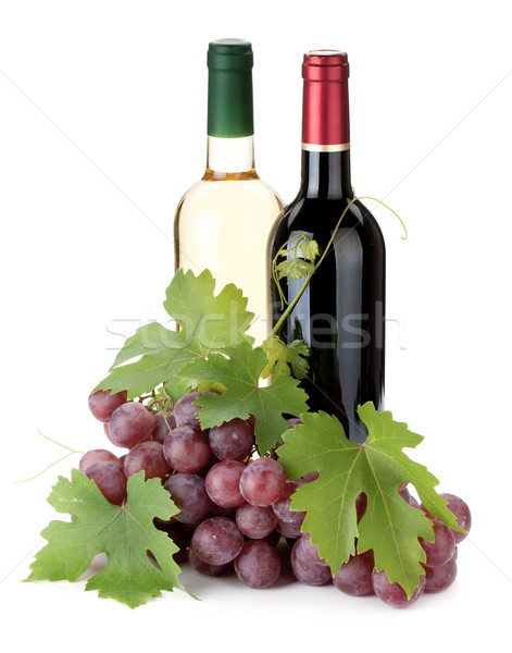 Two wine bottles and grapes Stock photo © karandaev