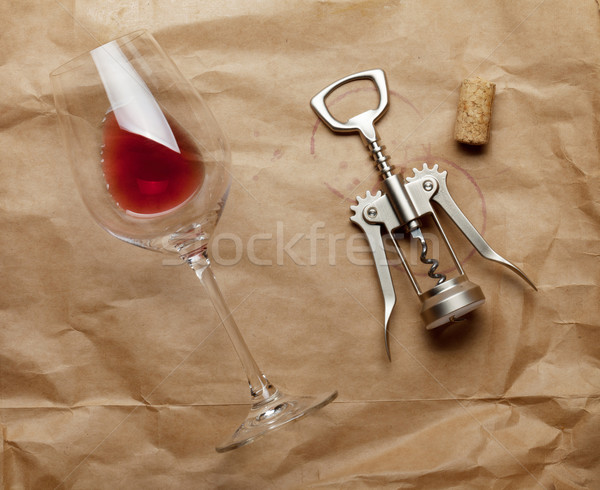 Wine glass, cork and corkscrew with red wine stains Stock photo © karandaev