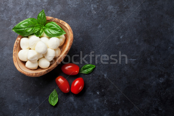 Mozzarella cheese, tomato and basil Stock photo © karandaev