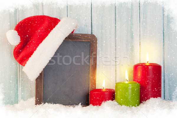 Christmas candles and chalkboard Stock photo © karandaev