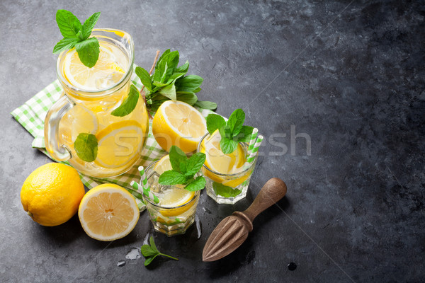 Lemonade with lemon, mint and ice Stock photo © karandaev