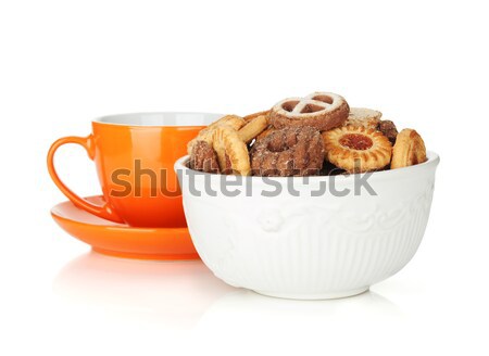 Various cookies in bowl and orange tea cup Stock photo © karandaev