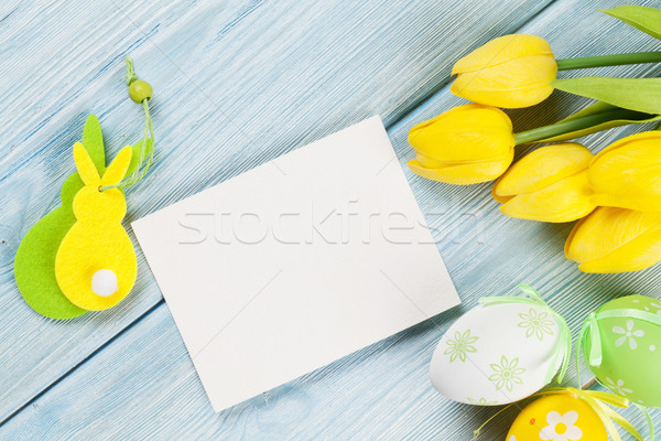 Easter eggs tulipani scheda vuota biglietto d'auguri blu tavolo in legno Foto d'archivio © karandaev
