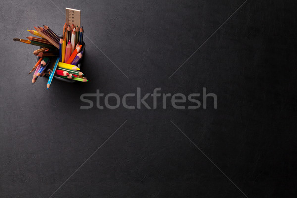 Office leather desk table with colorful pencils Stock photo © karandaev