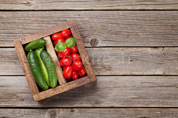 Vegetables in wooden box Stock photo © karandaev