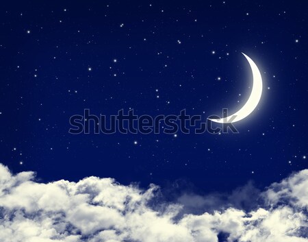 Moon and stars in a cloudy night blue sky Stock photo © karandaev