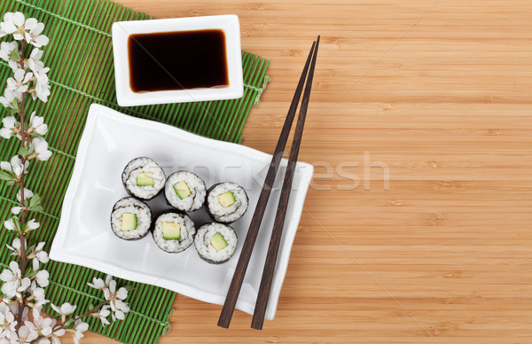 Sushi maki set with fresh sakura branch Stock photo © karandaev