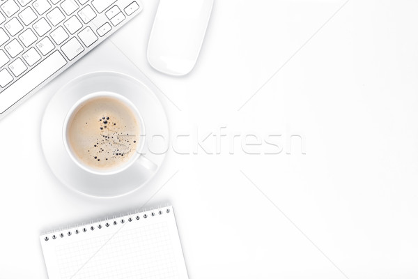 Stock photo: Office desk table with computer, supplies and coffee cup