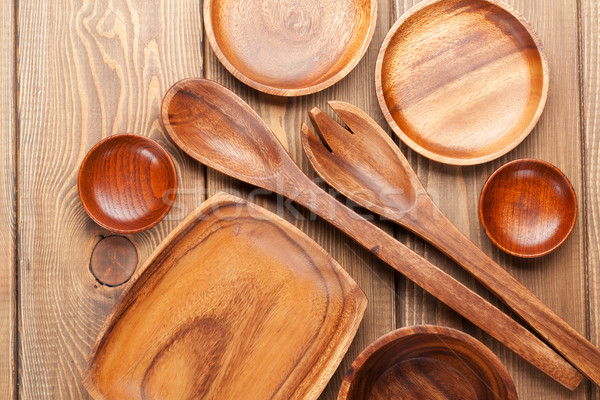 Stock photo: Wood kitchen utensils over wooden table