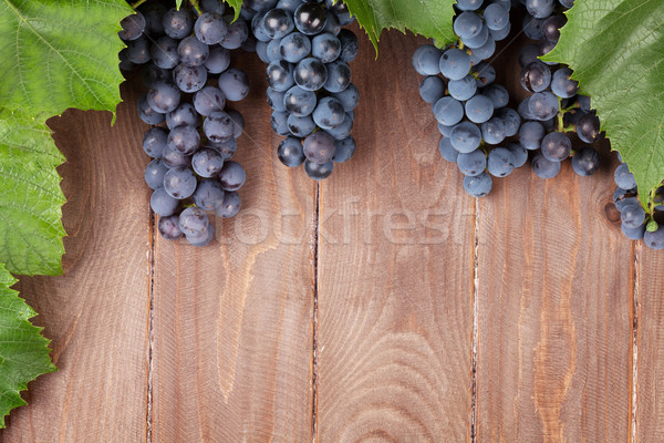 Red grape on wooden table Stock photo © karandaev