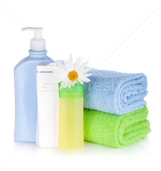 Shampoo and gel bottles with towels and flower Stock photo © karandaev
